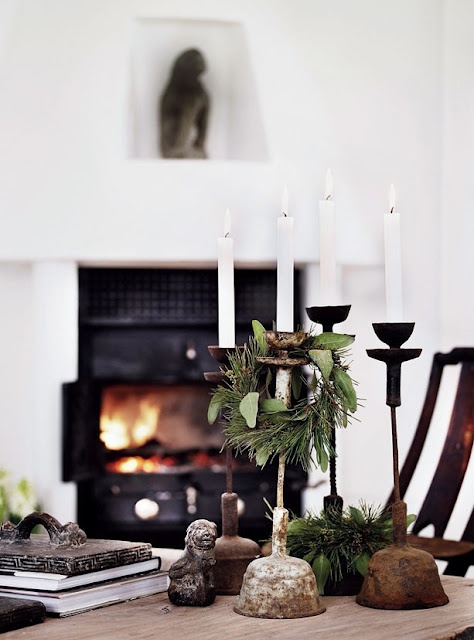 elegant room detail created by white candles and iron candleholders