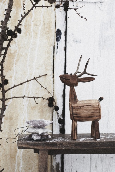 christmas decor by wooden reindeer